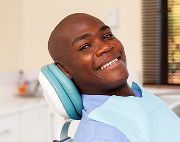 man smiling in dentist chair